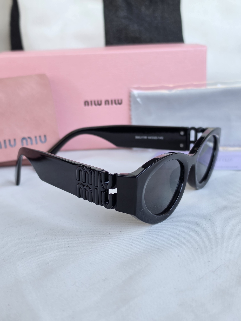 Miu Miu Glossy Black Round-Frame Sunglasses with Logo Temples